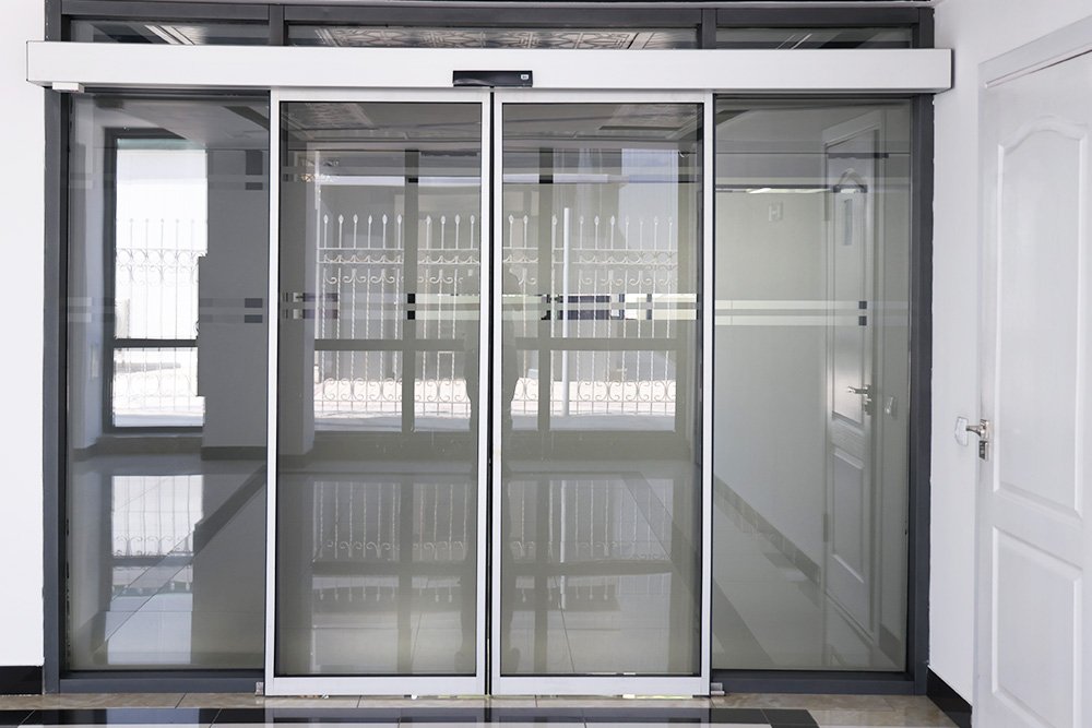 interior-modern-office-building-detail-glass-elevator-door